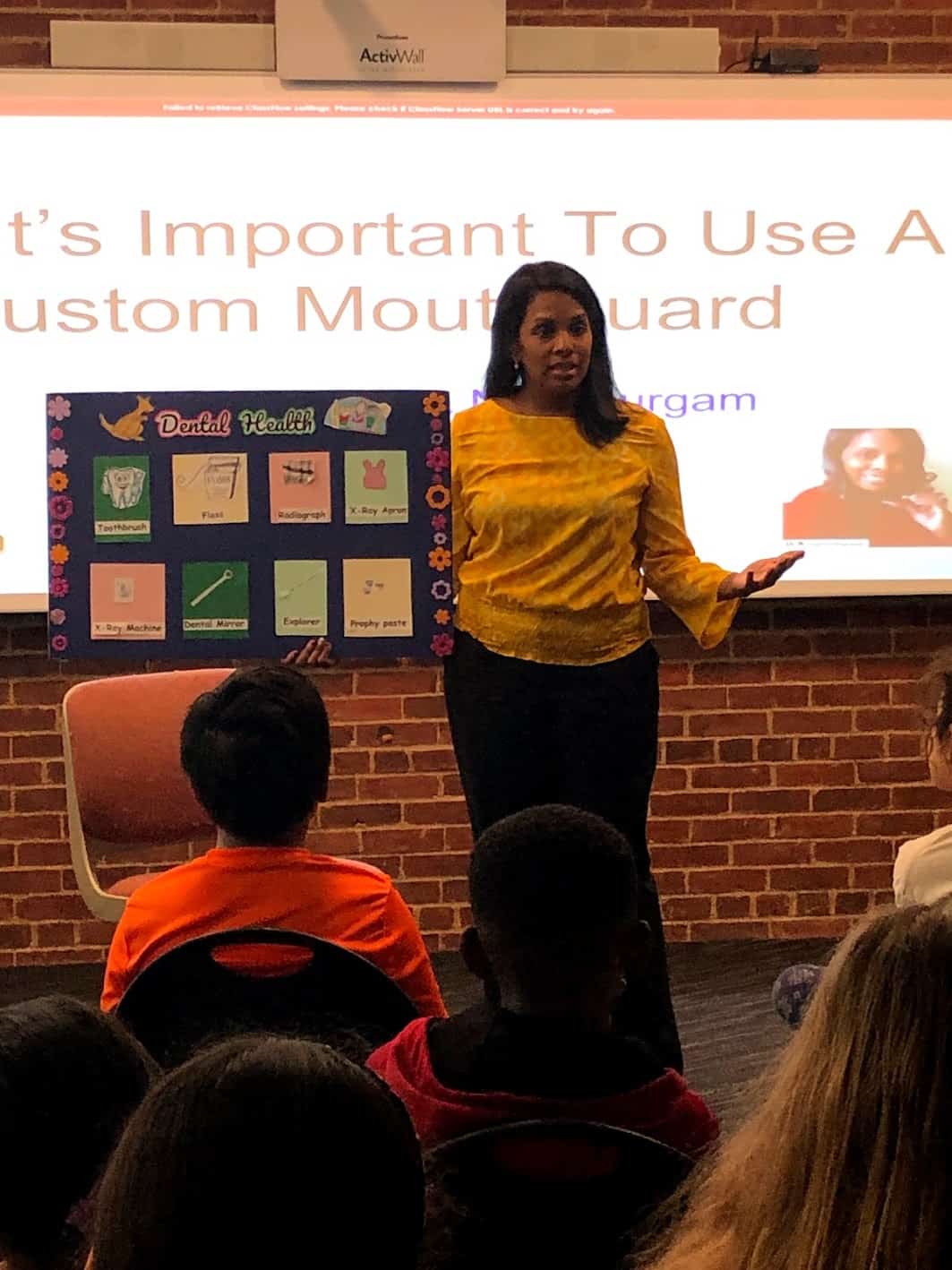 Dr. Durgam talks to students in West New York about the importance of dental health